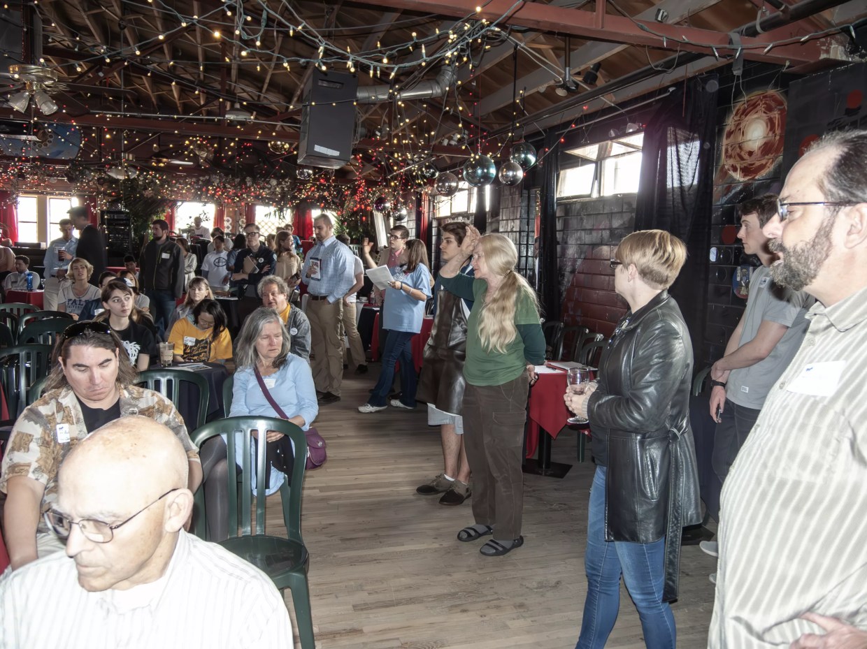 woman talking to gathering in cafe