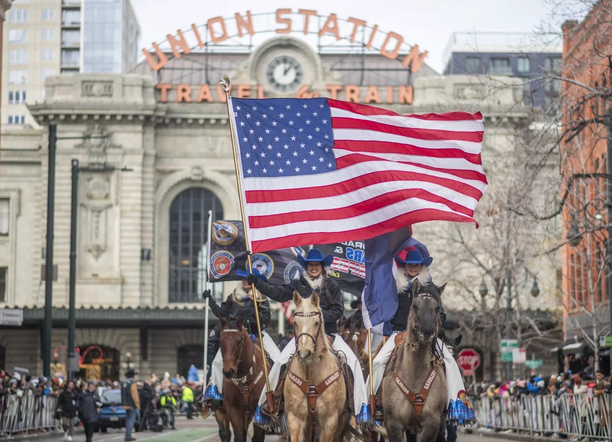 flag and horses in parade