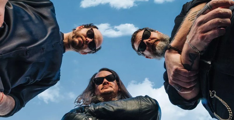 The three members of Palehorse/Palerider looking downward