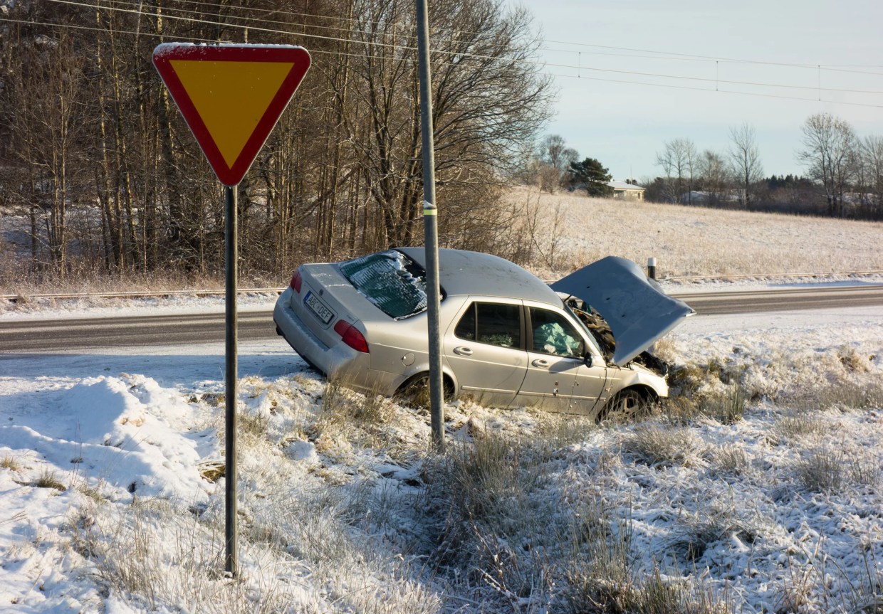 car crashes into snowy hill
