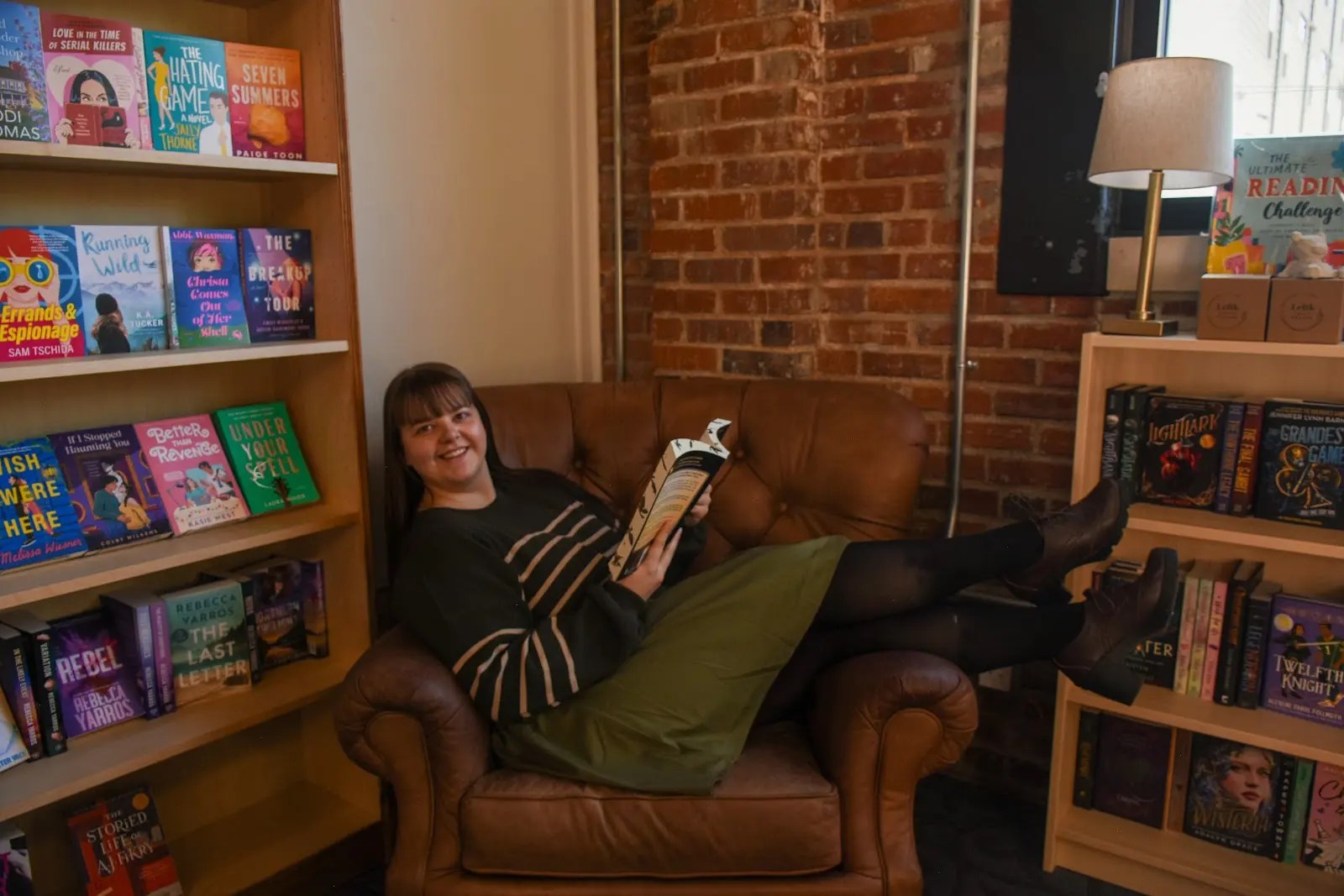 Sydney Ivey in a chair in a bookstore