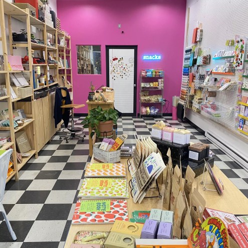 A shop with black and white tiles and pink walls
