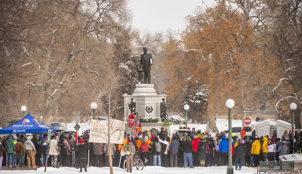 group by MLK sculpture in snow