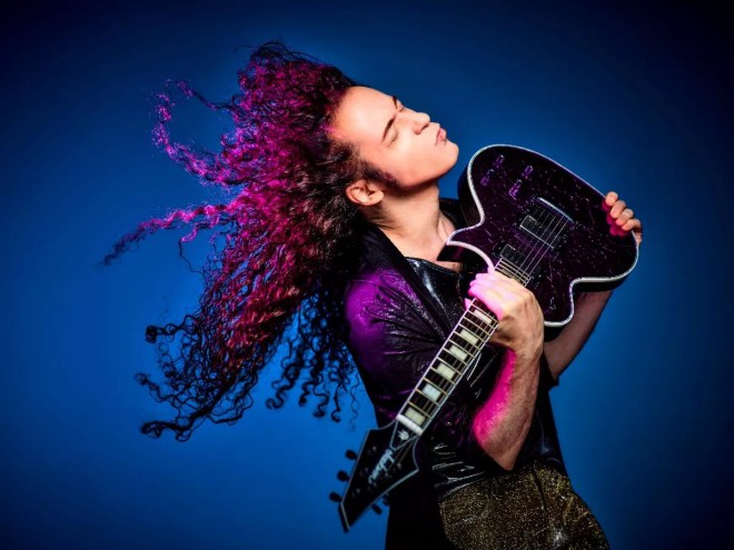 marty friedman caressing his guitar