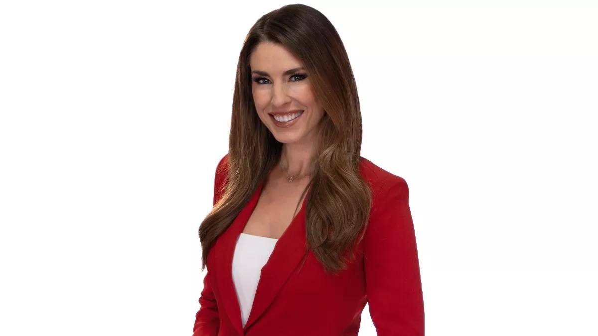 woman with brown hair, red jacket