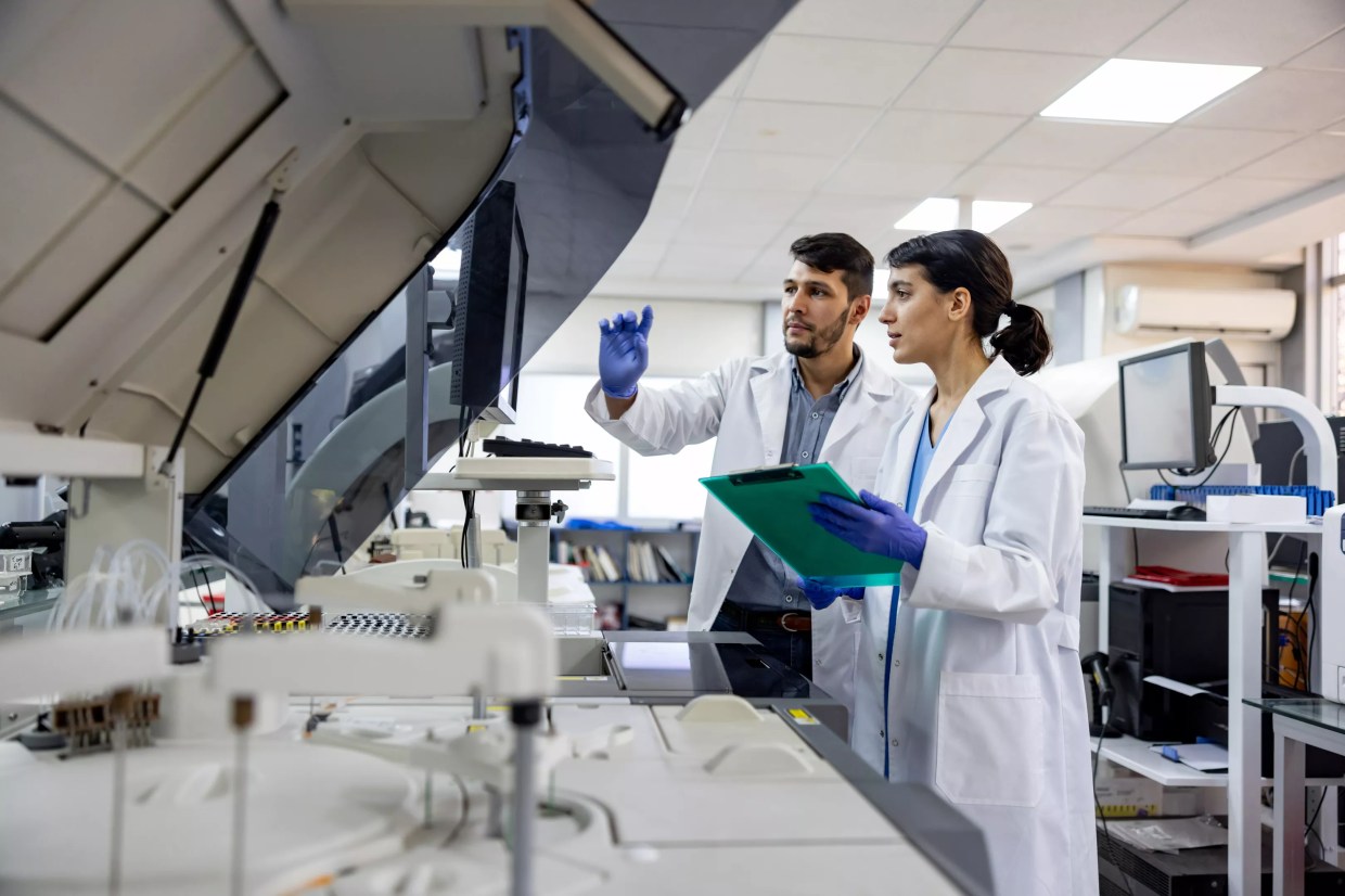 man and woman in lab coats
