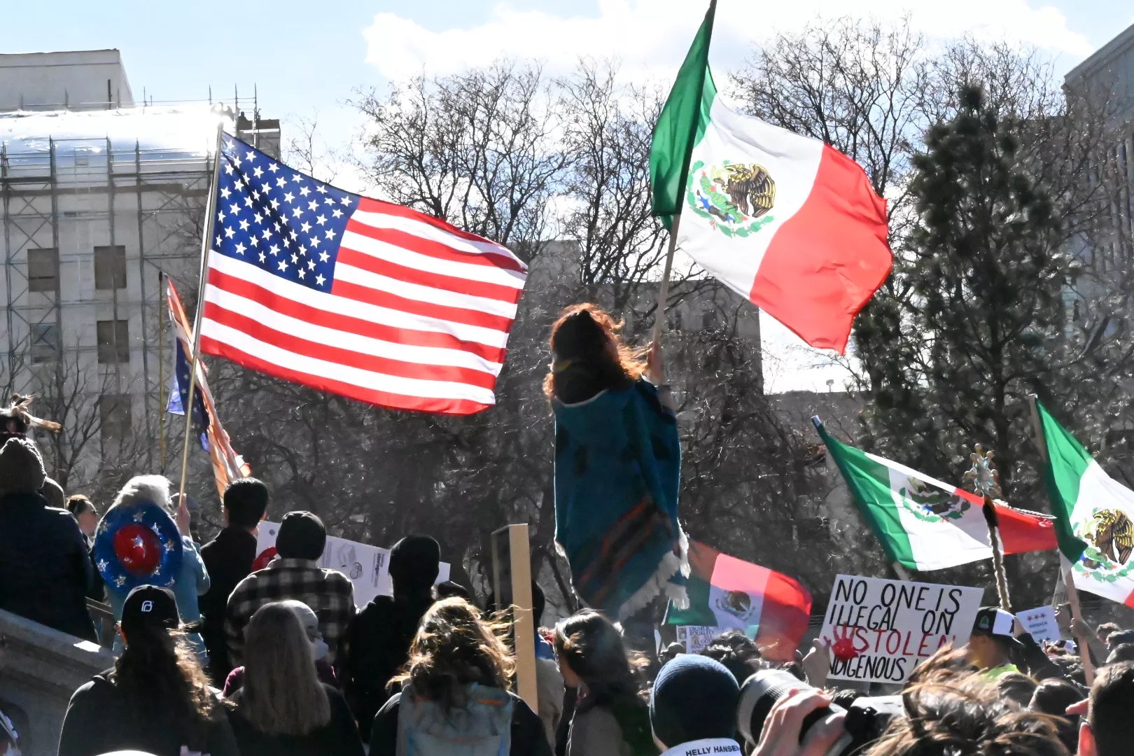 A woman raises a flag.