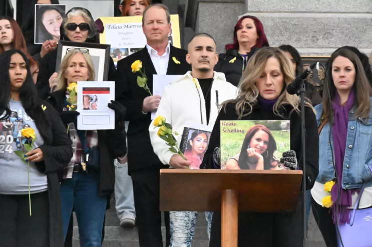 Laura Saxton reads the name of her daughter, Kelsie Shelling, and holds up her picture as part of the tenth annual Colorado Missing Persons ceremony on Tuesday, February 4.