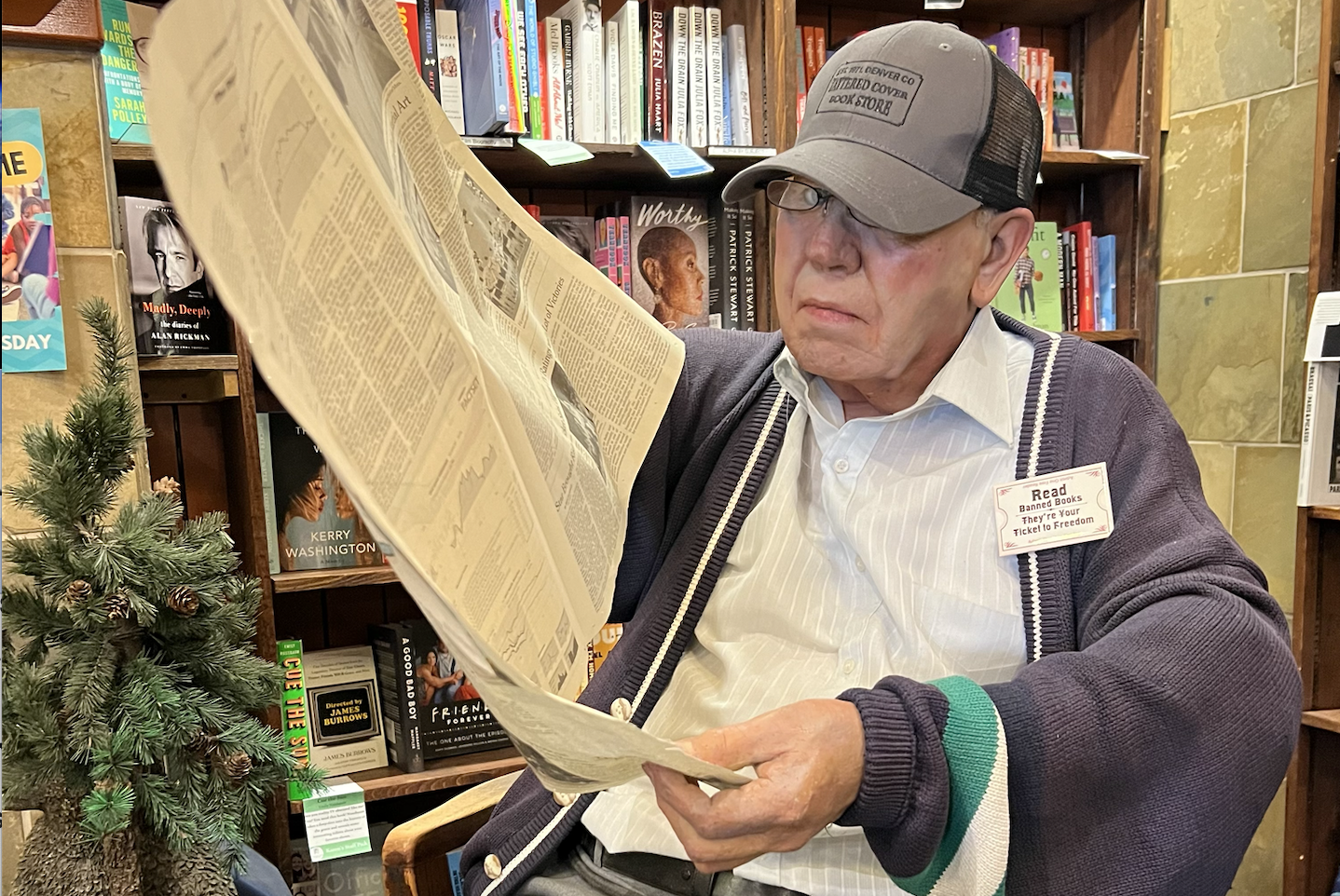 Charlie the Mannequin reading a newspaper