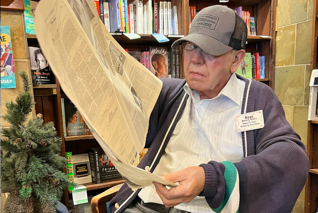 Charlie the Mannequin reading a newspaper