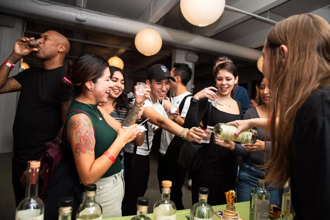 people drinking mezcal