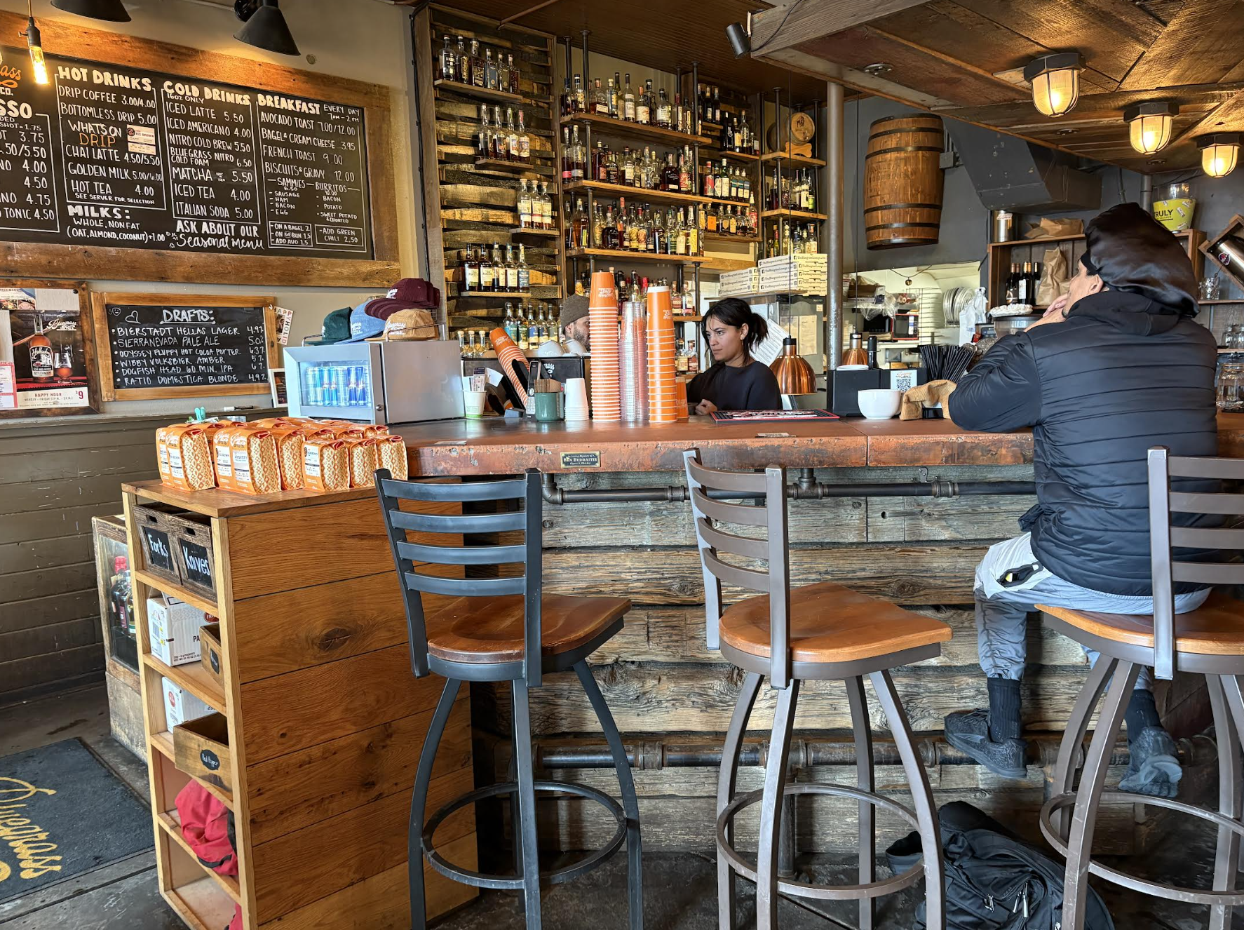 A person sitting at a bar