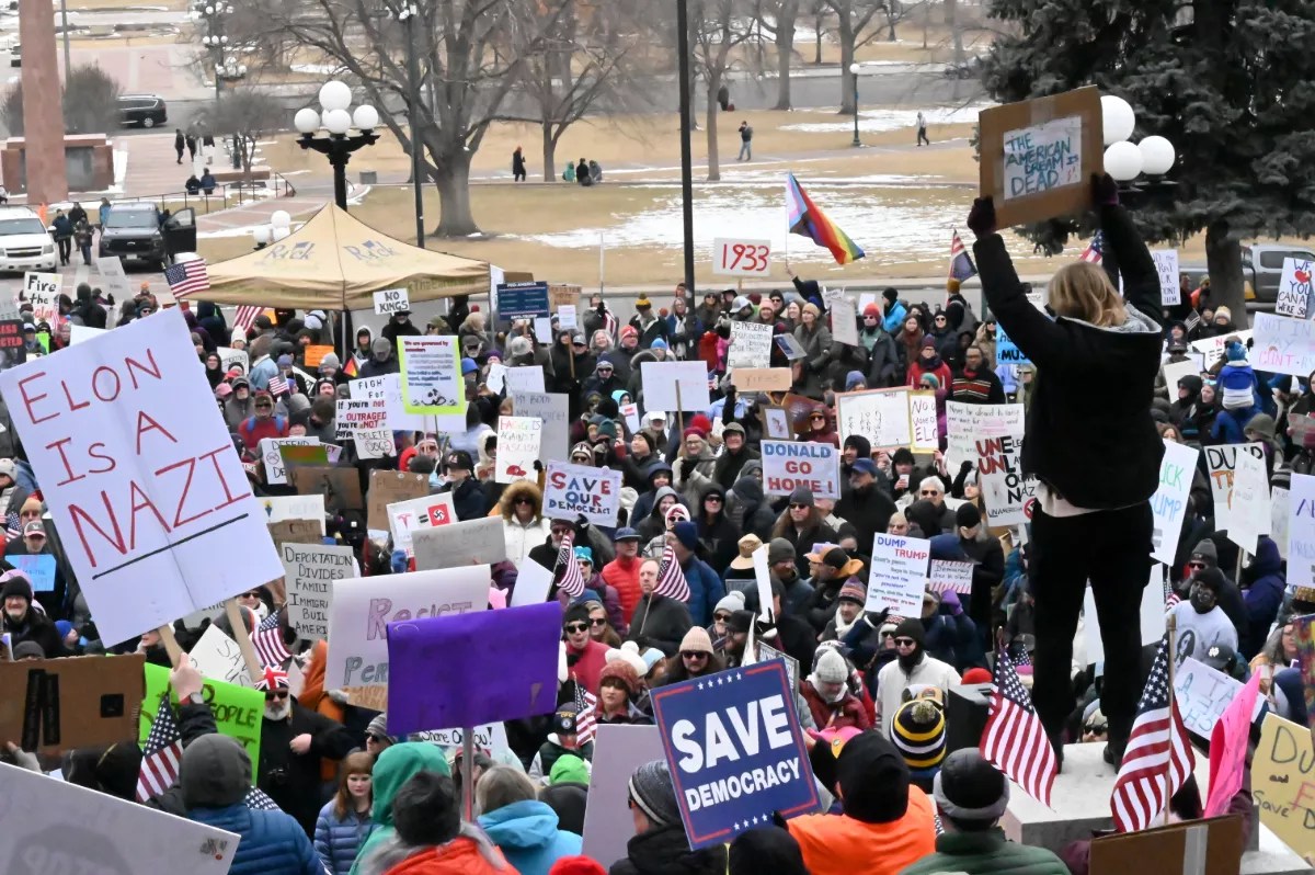 Protesters stand at the capitol.