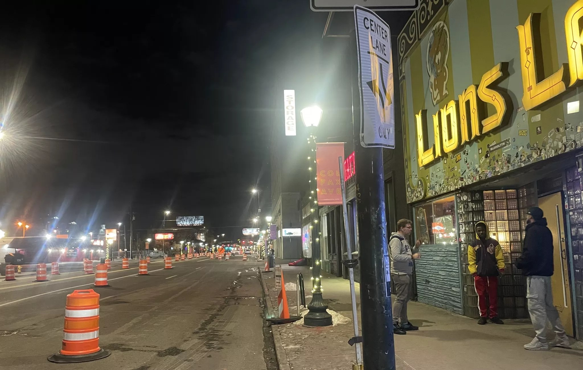 traffic cones in front of a bar