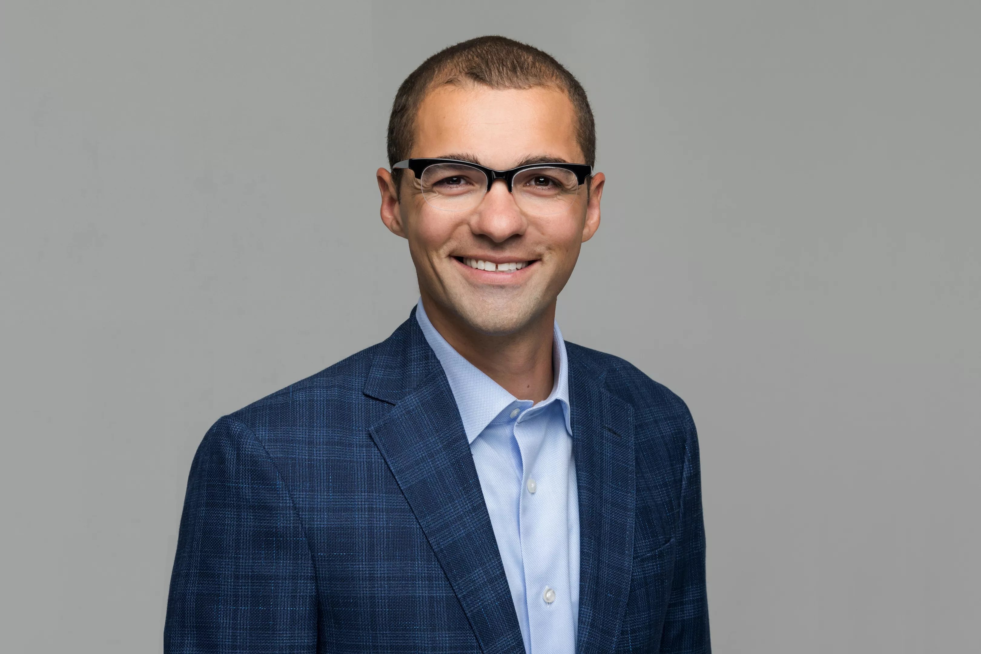 man in blue jacket with tie