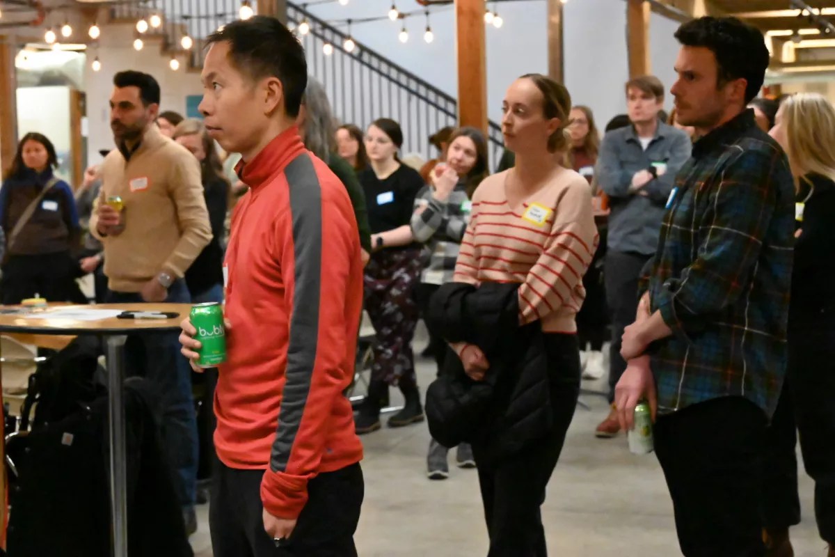 People stand and talk during party