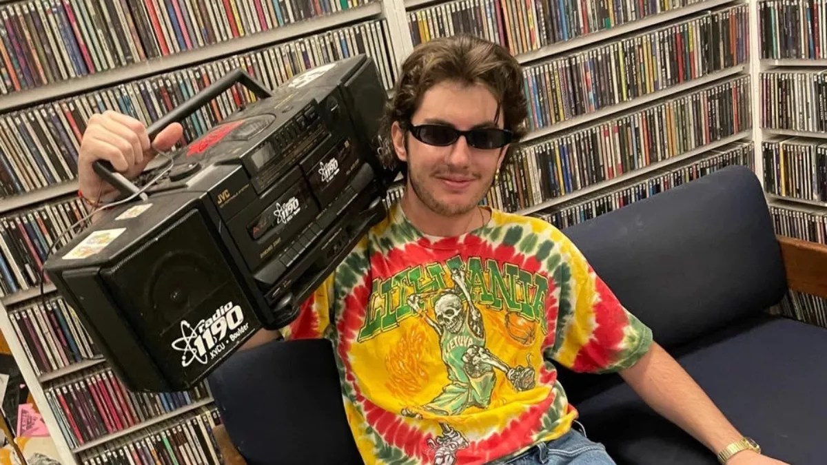 man in tie-dyed shirt with radio