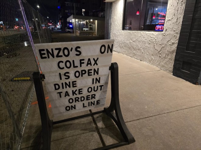 white sign with black letters