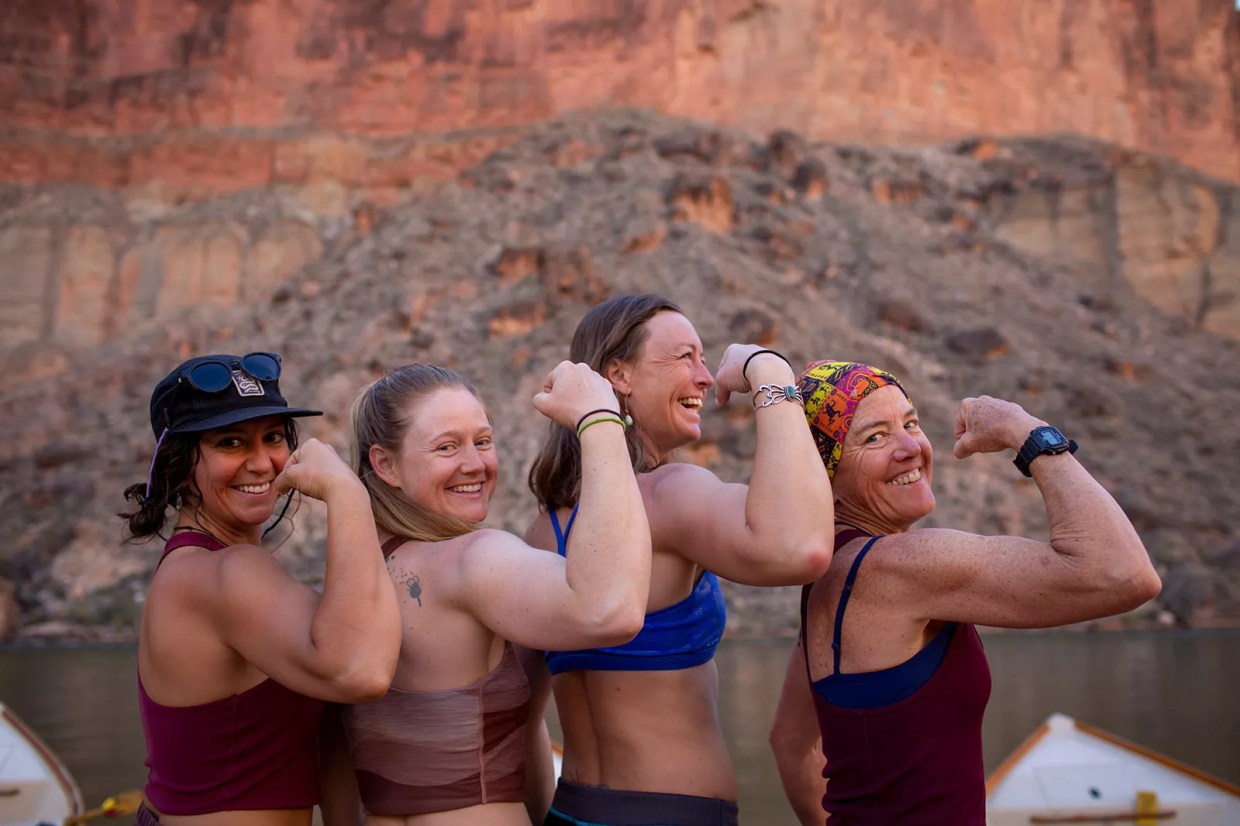 Four women pose together in the Grand Canyon.