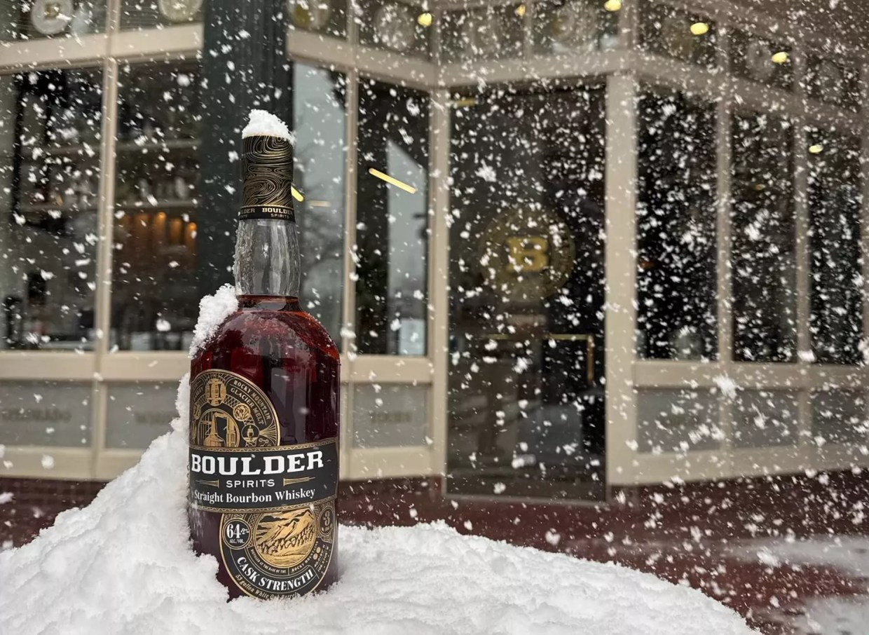 bottle of bourbon in the snow