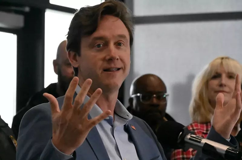 man with hand outstretched