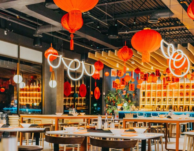 red lanterns hanging over a restaurant dining room