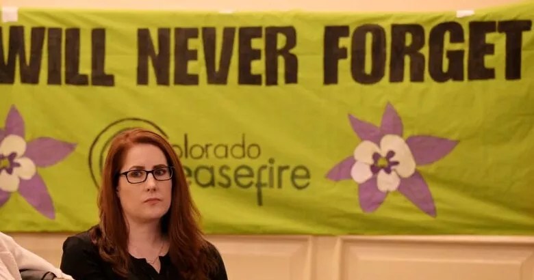 woman by never forget banner