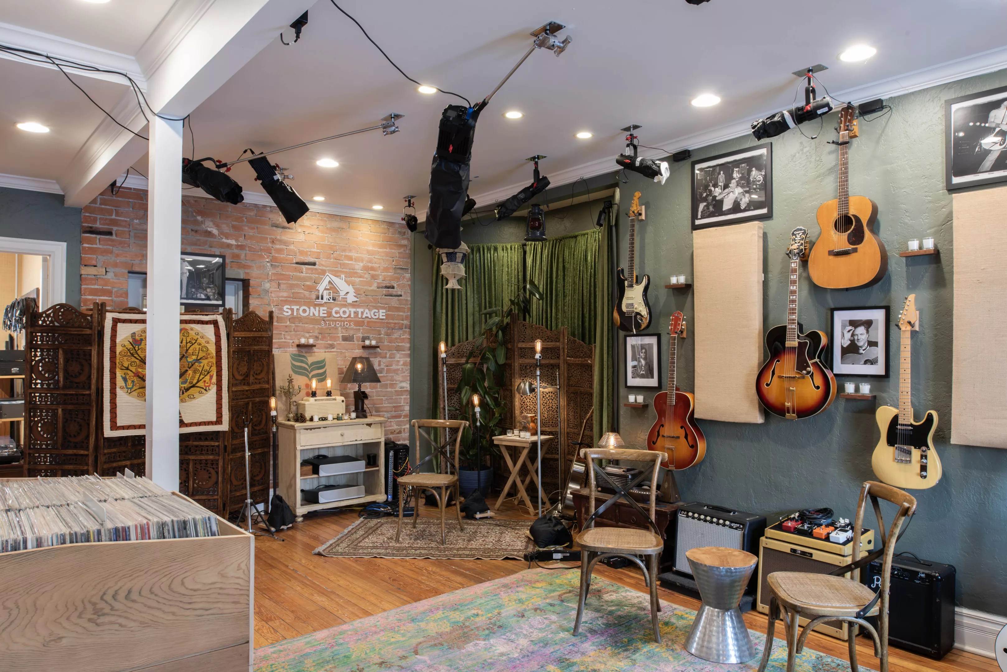 a room with guitars on the wall