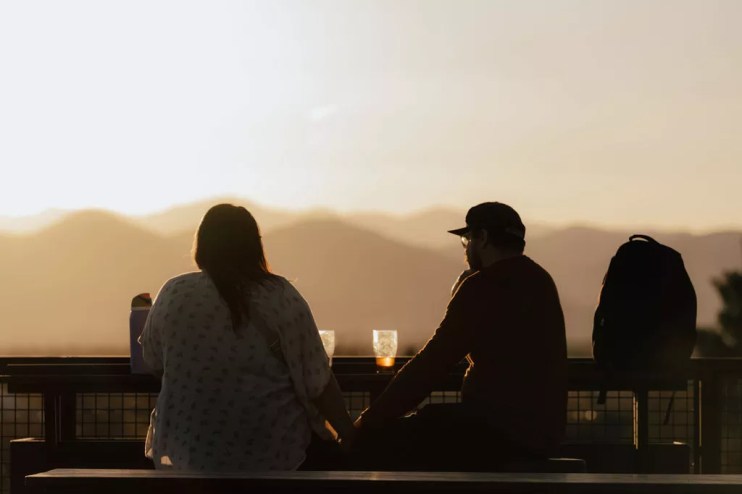 Rooftop patio with mountain views.