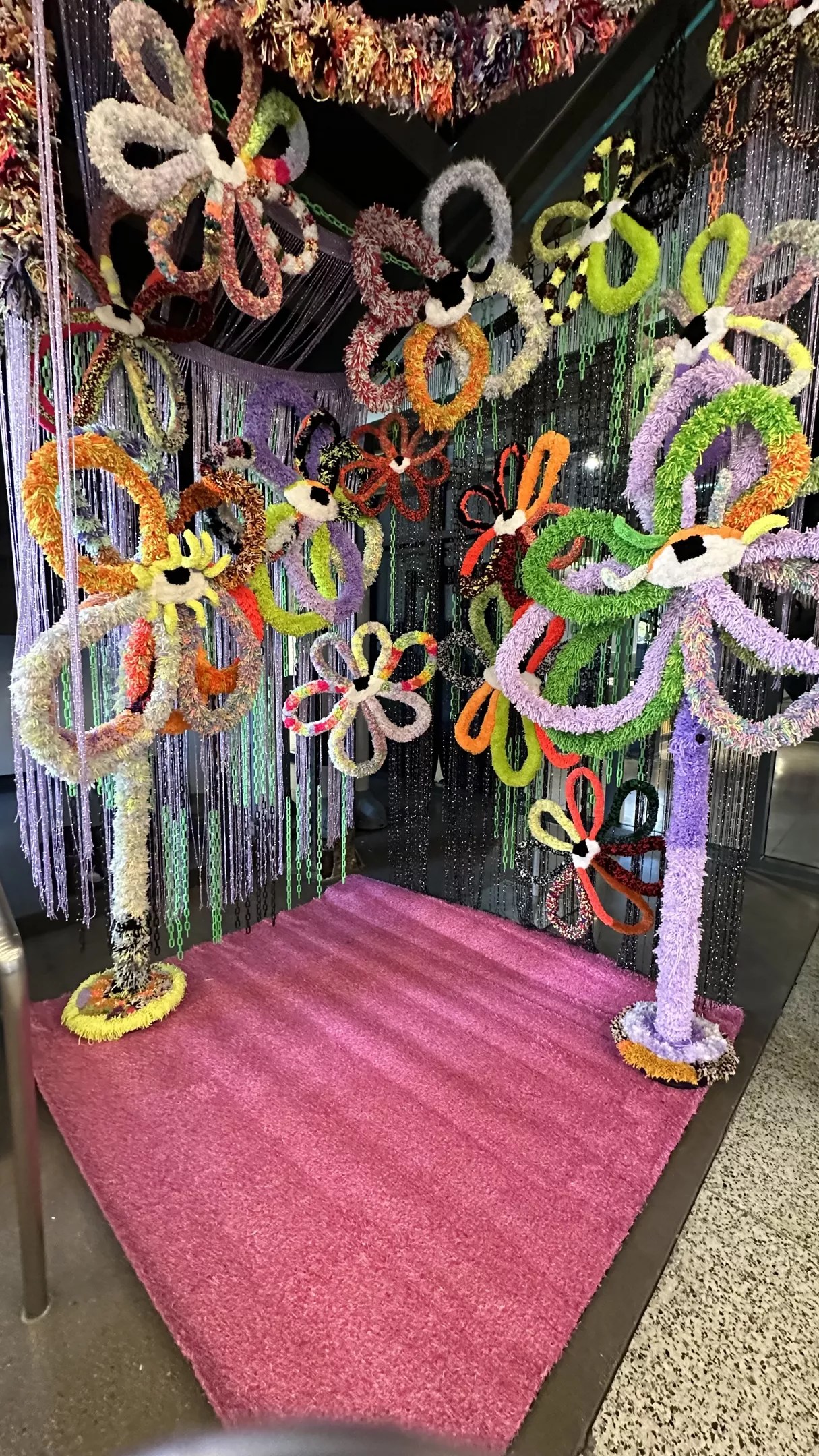 Colorful yarn flower sculptures
