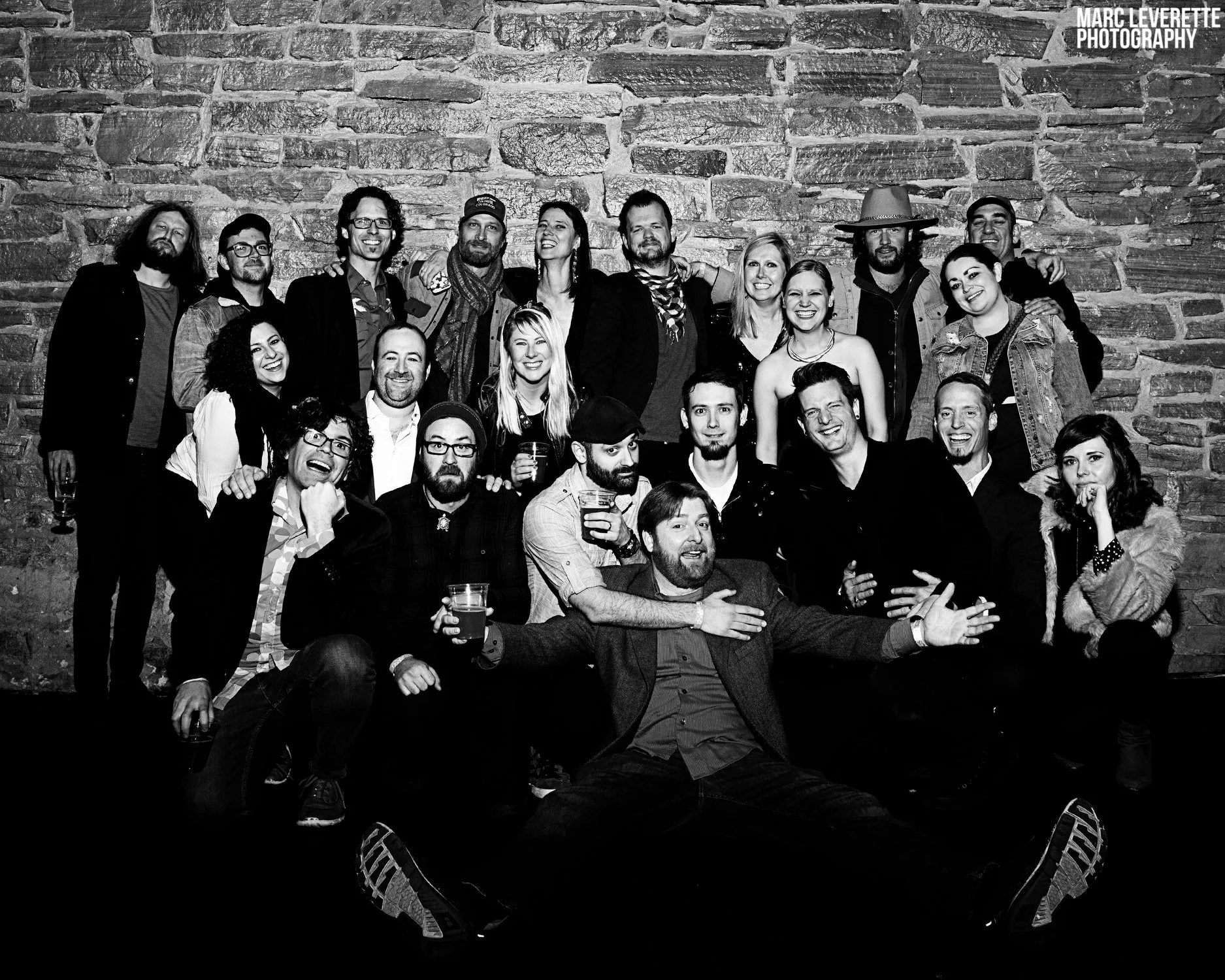 a lot of people smile for  a group photo at the FoCo  Peer Awards