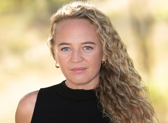 A portrait of a woman with blond hair