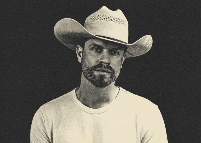 man in a white cowboy hat