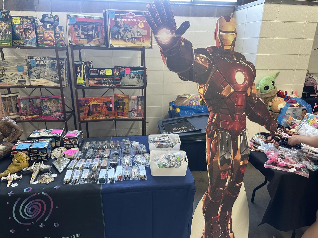 A table with iron man memorabilia