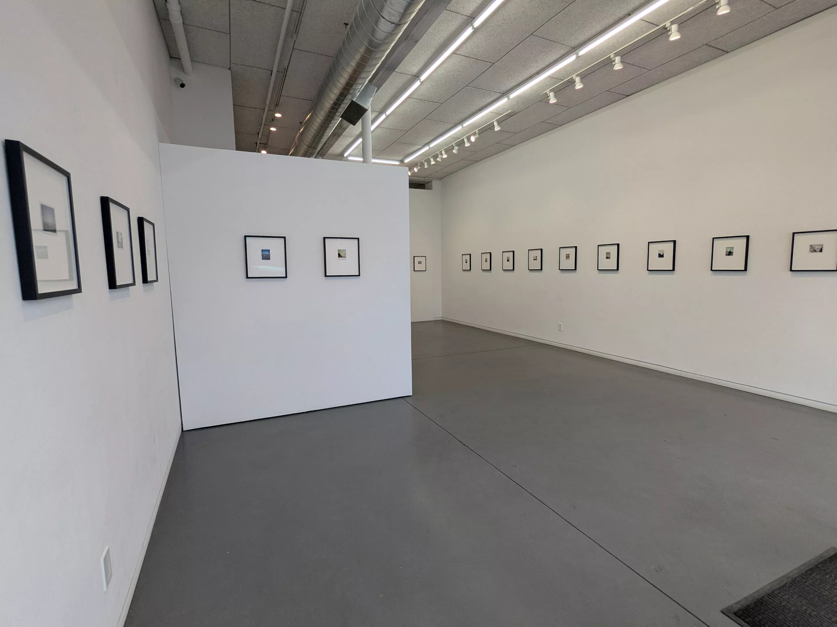 A gallery with white walls