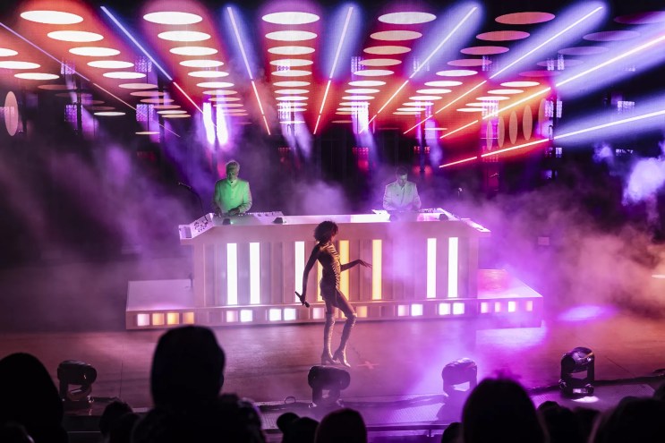 A photo of Polo Pan with performer Victoria Lafaurie on stage.