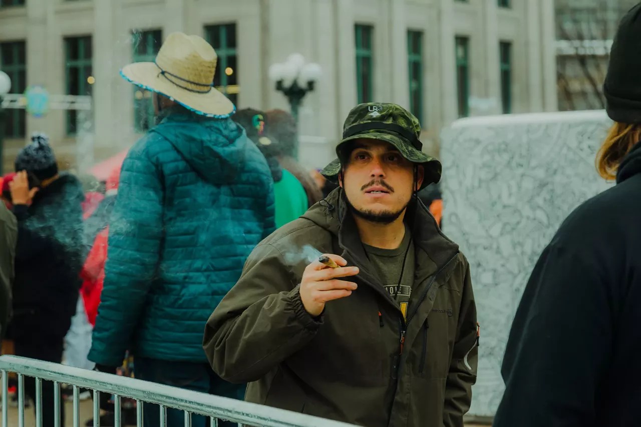 Man smokes joint at concert