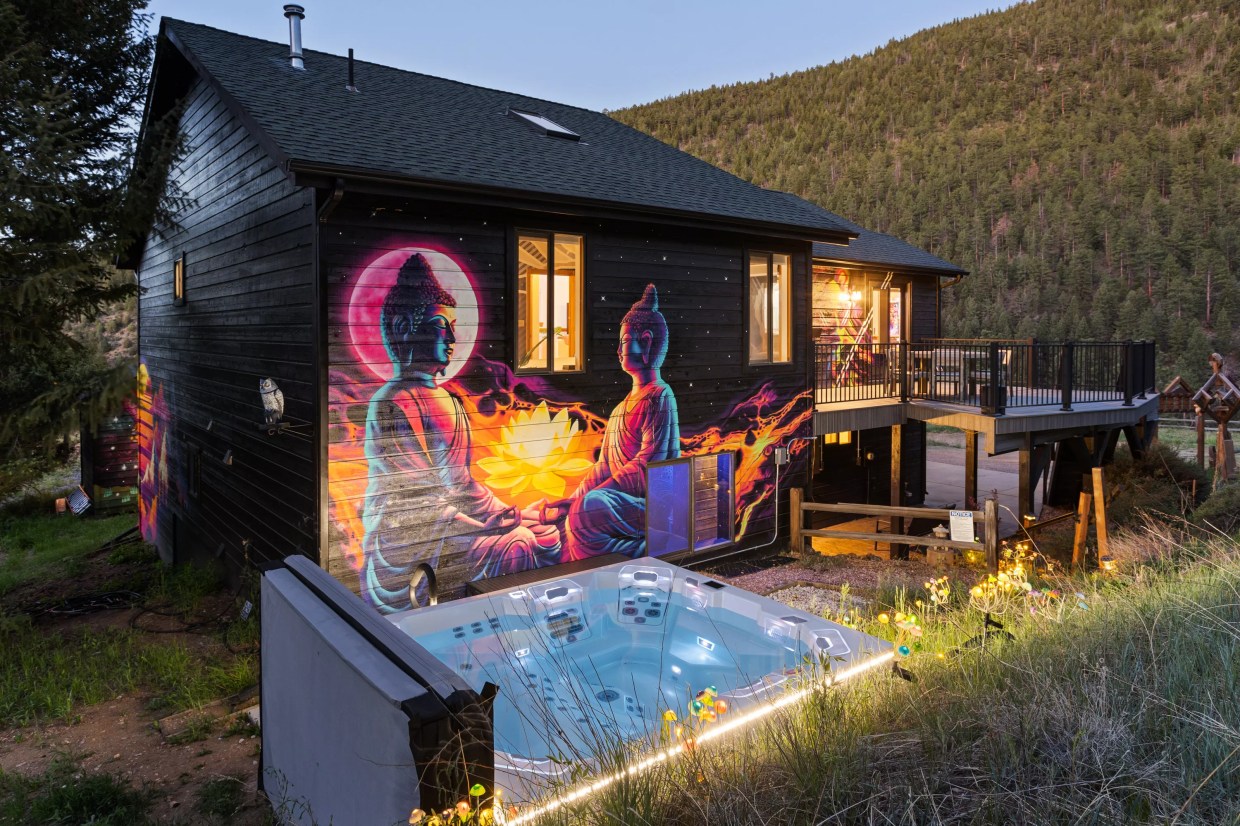 A colorful mural and hot tub