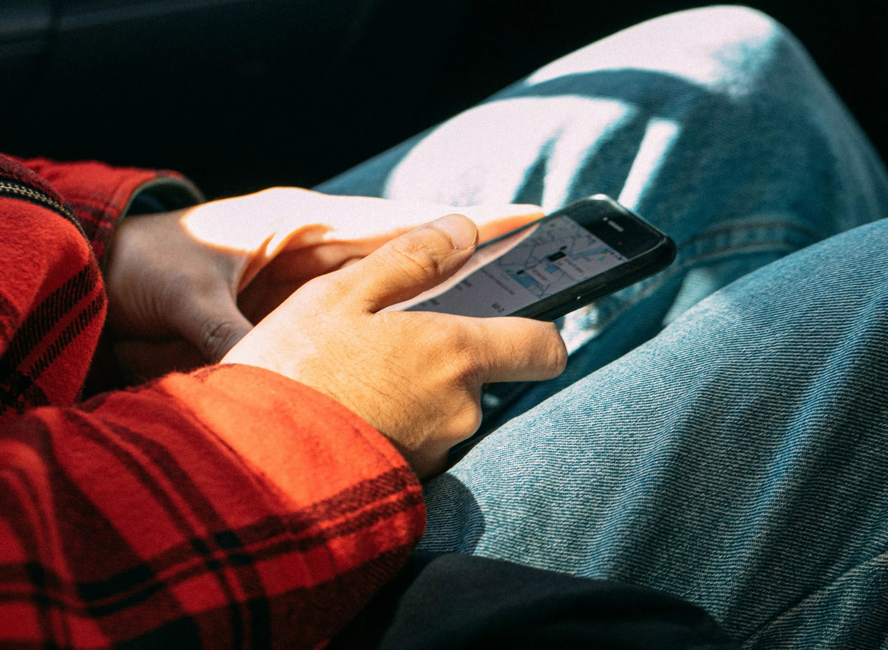 person using uber app on phone