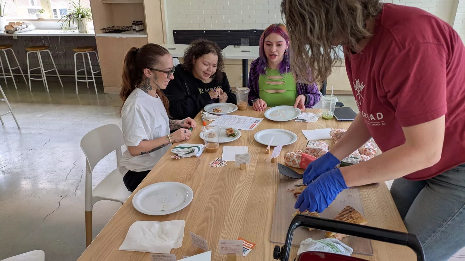 youth at table picking pastries