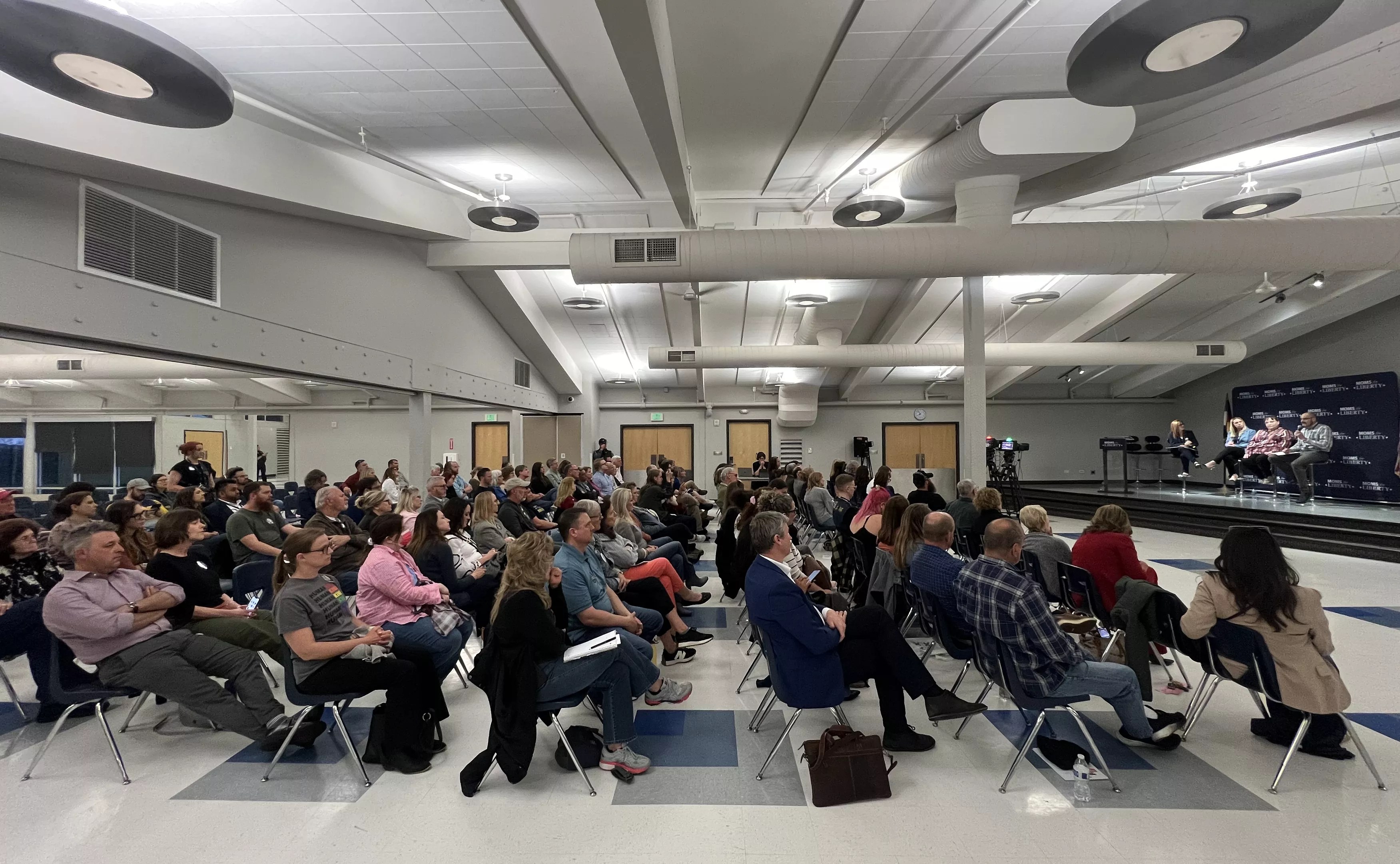 crowd of people at transgender meeting