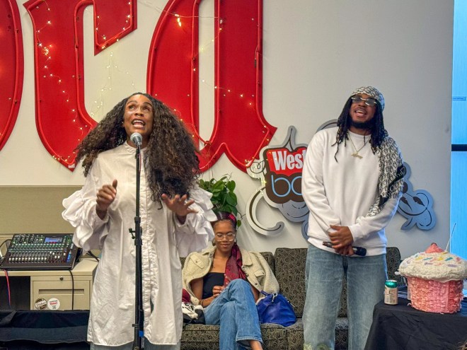 Dominique Christina and DNA Picasso performing in the Denver Westword office