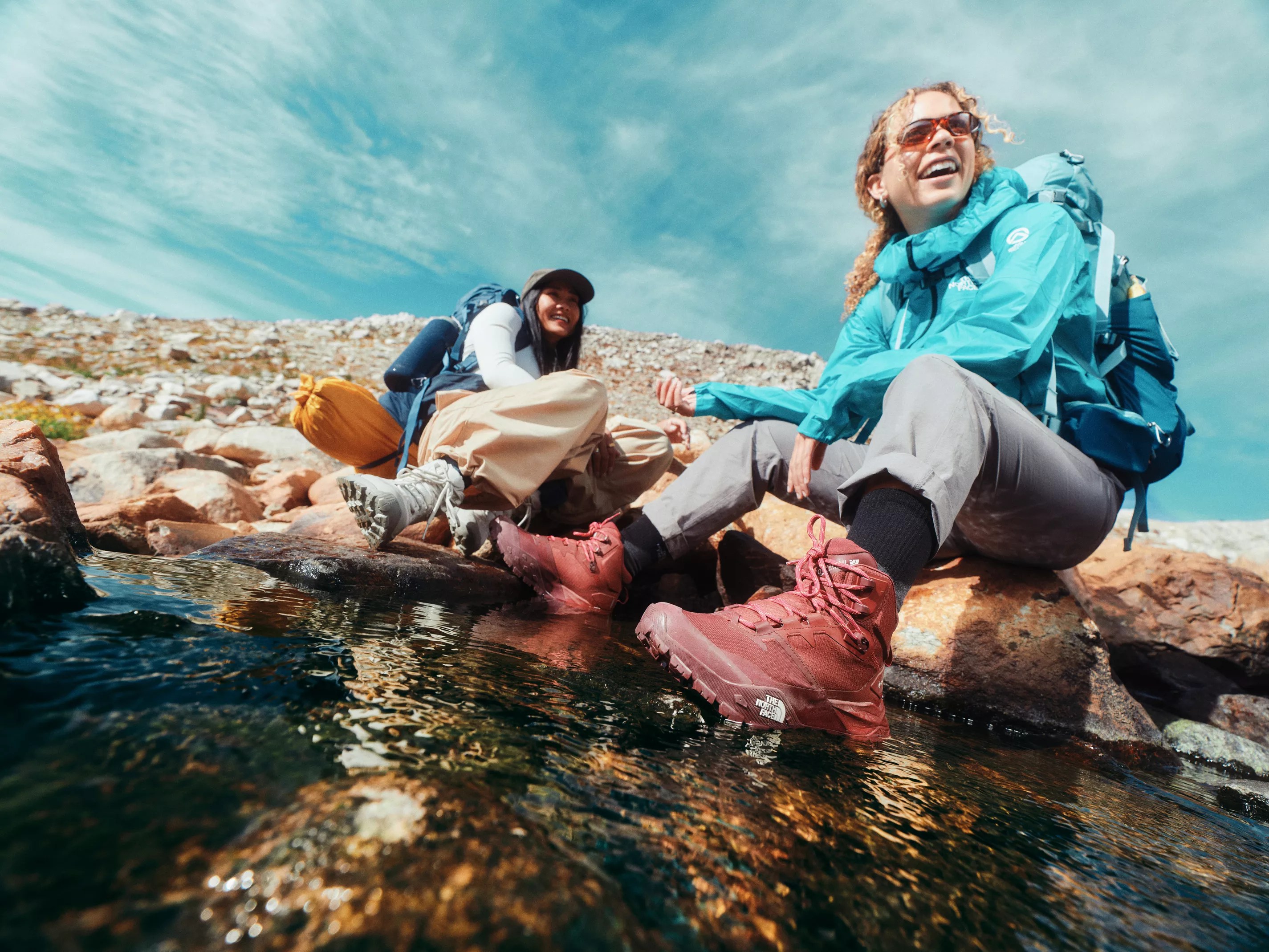 Two hikers dressed in The North Face apparel and footwear