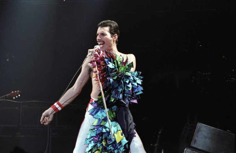 Freddie Mercury performing on stage