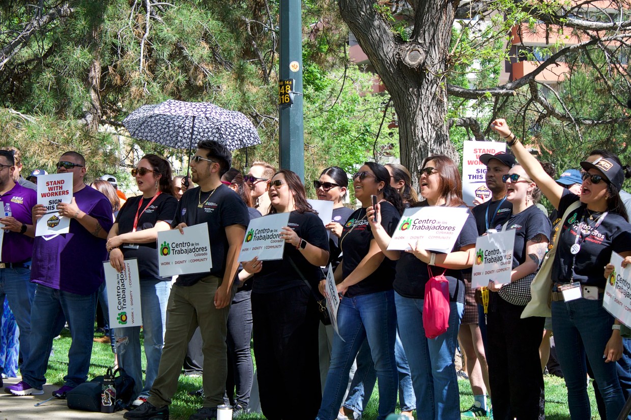 Labor advocates gather at Governor's Park in Denver to rally in support of a just-cause employment ballot measure proposal.