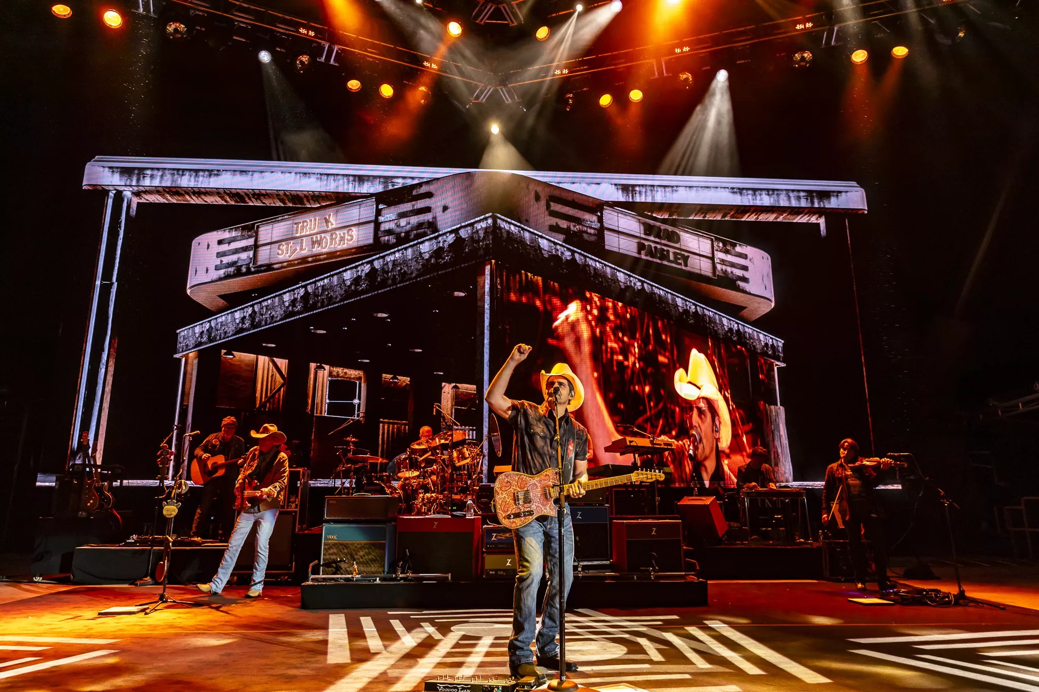 A photo showing Brad Paisley on stage at Red Rocks with his full stage production behind him.