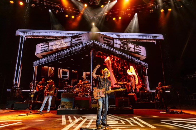 A photo showing Brad Paisley on stage at Red Rocks with his full stage production behind him.