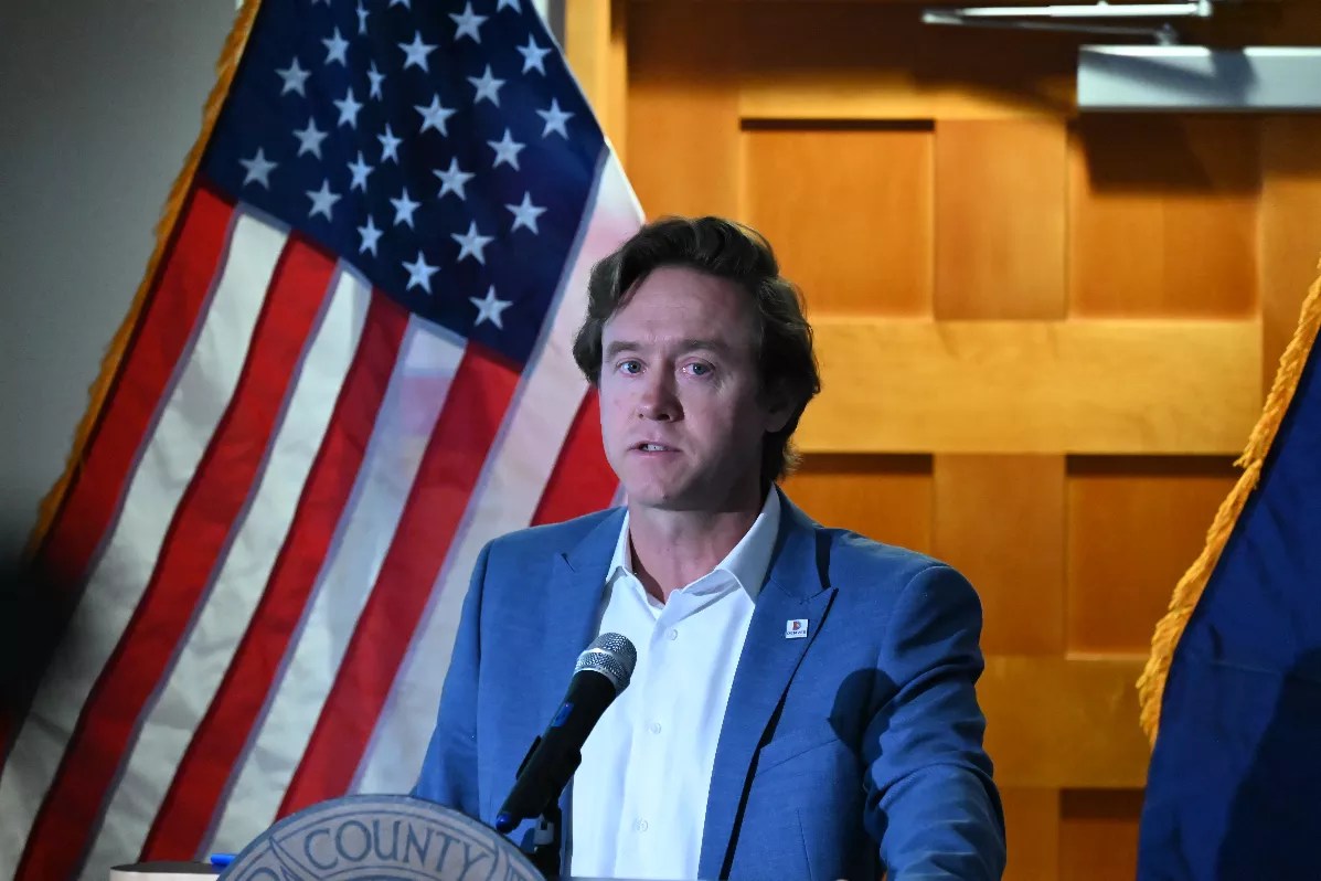 A man in front of glag