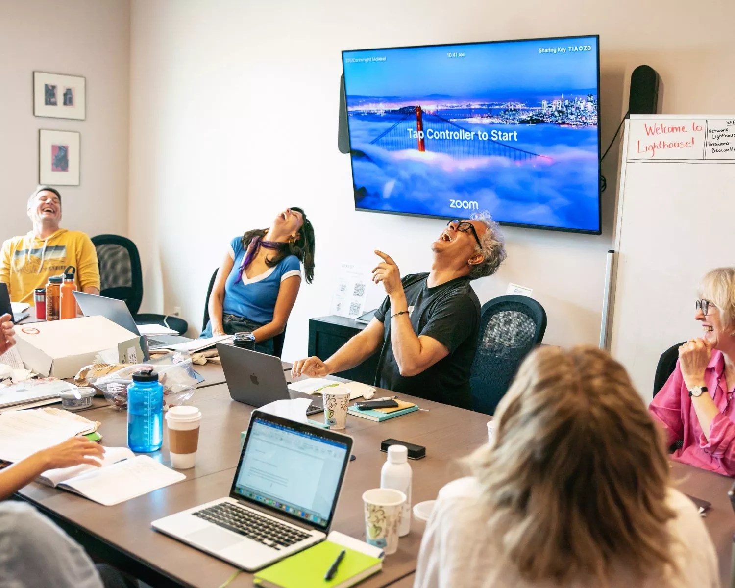 People laugh at a table