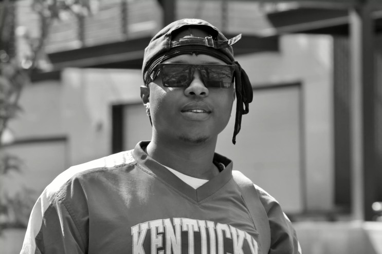 man in a hat and sunglasses